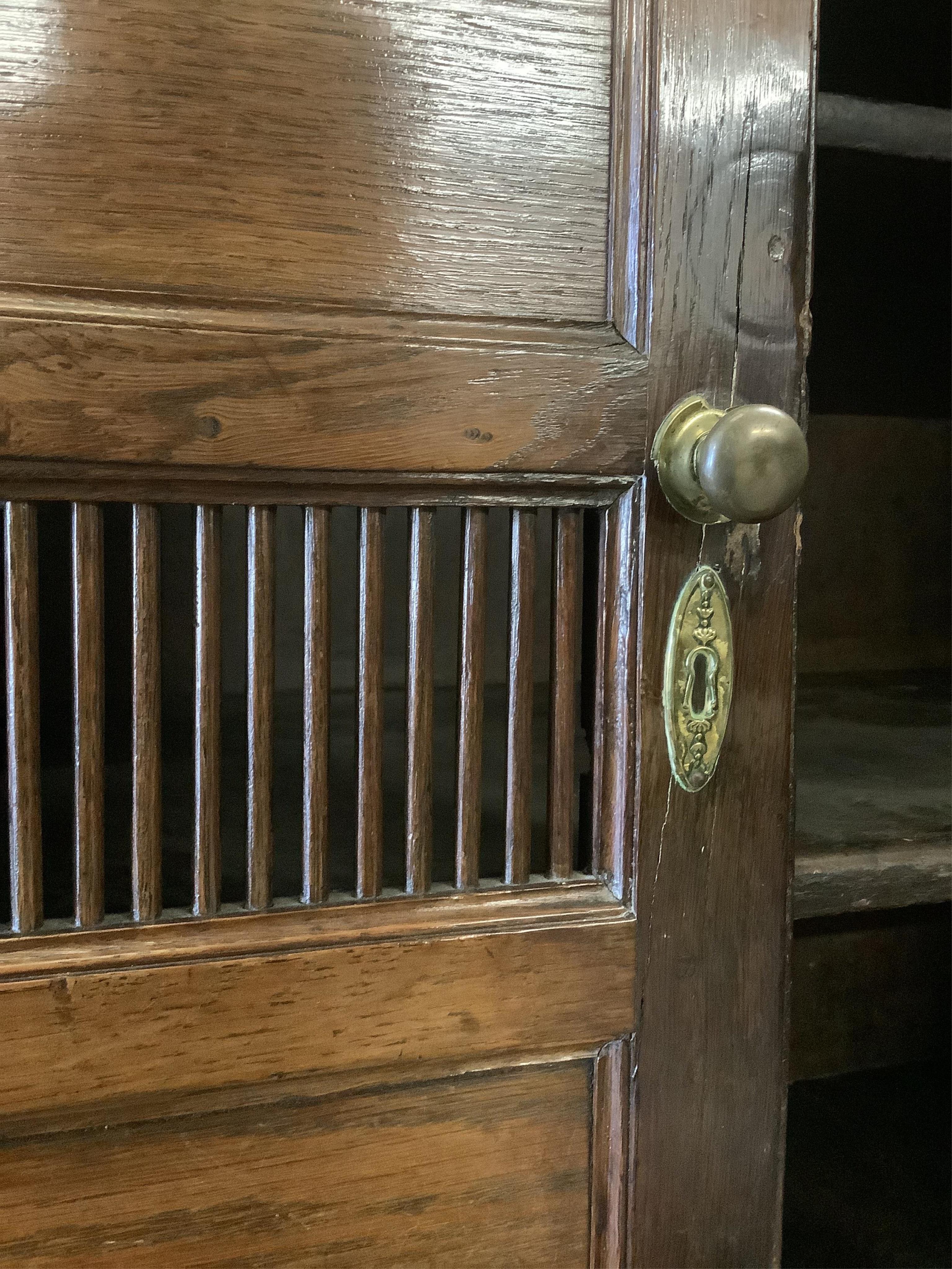 A late 18th century oak cupboard, width 113cm, height 186cm. Condition - fair to good